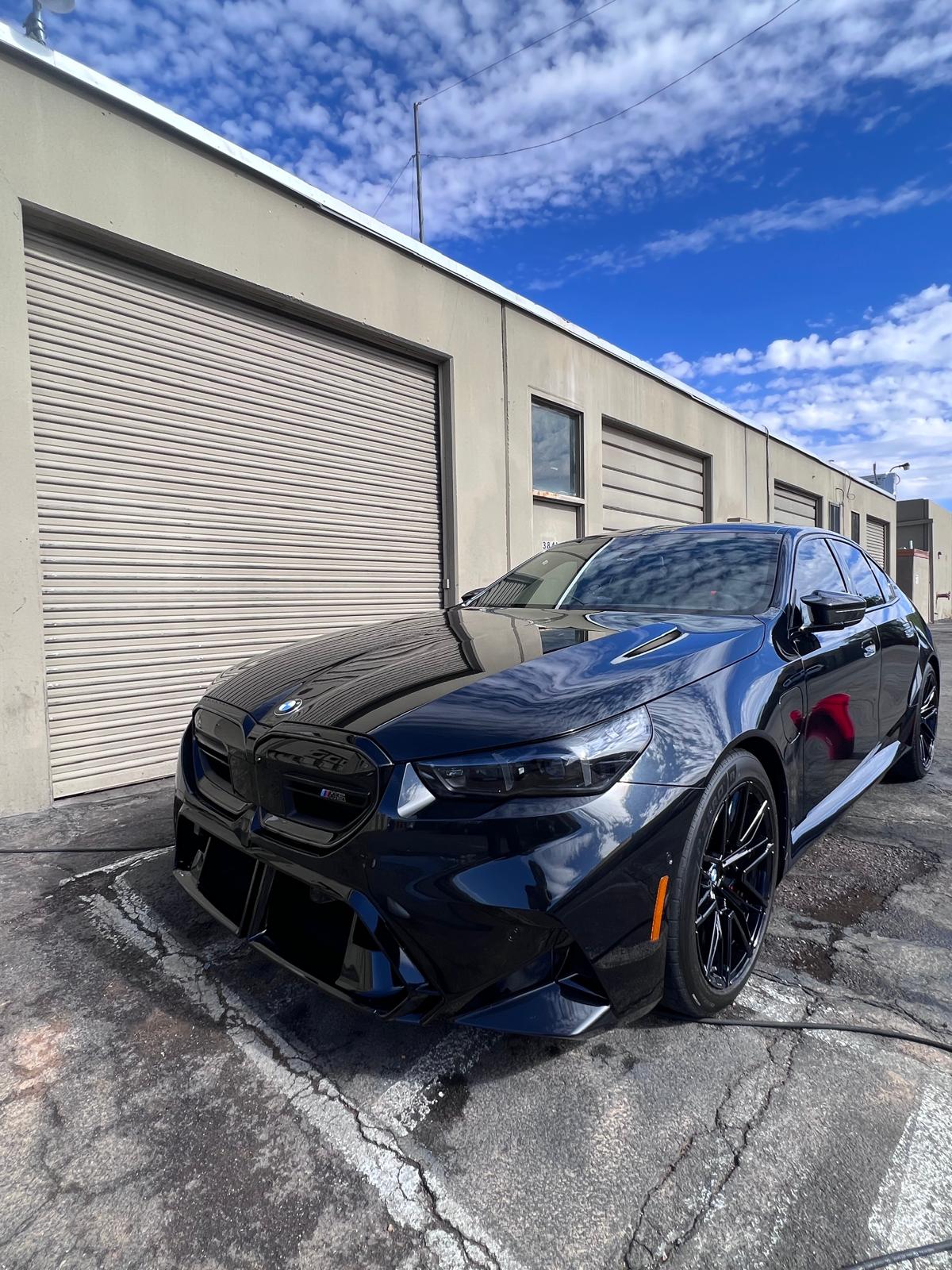 Black BMW M5 after ceramic window tint installation at Nogales Window Tint